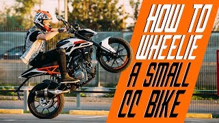 How to wheelie a small cc bike  RokON VLOG 25 [upl. by O'Donovan]